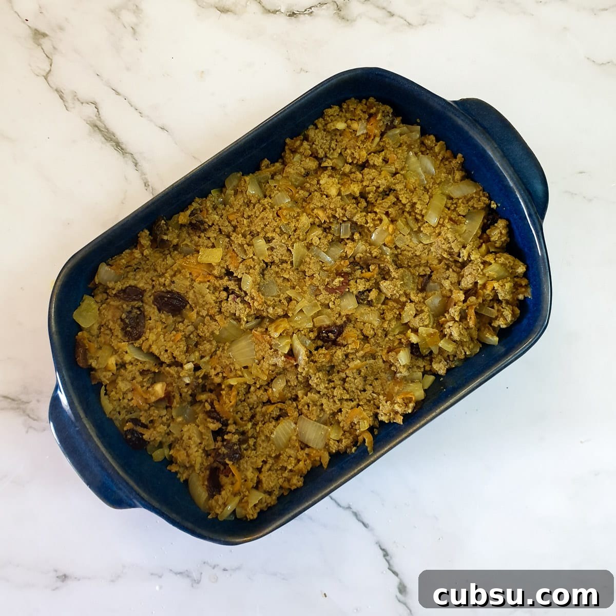 Bobotie mince in a baking dish.