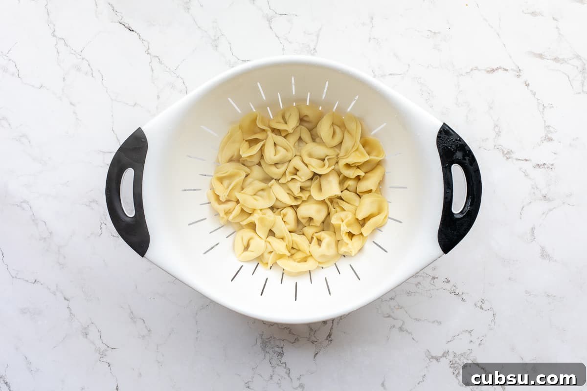 drained tortellini in colander