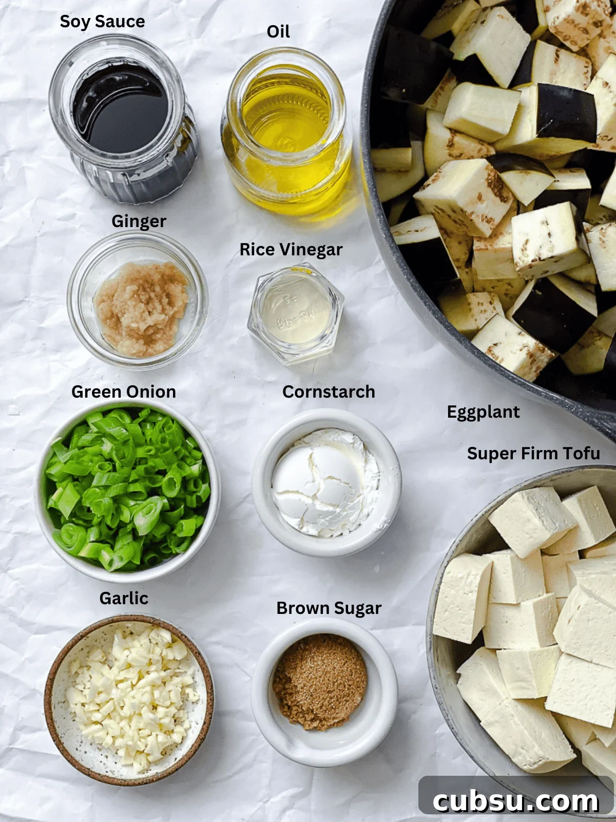 ingredients for Sticky Eggplant and Tofu [Bake + Stir-Fry] measured out on a white surface