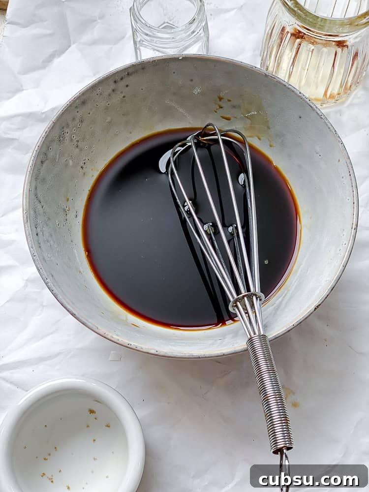 process shot showing stirring sauce in bowl