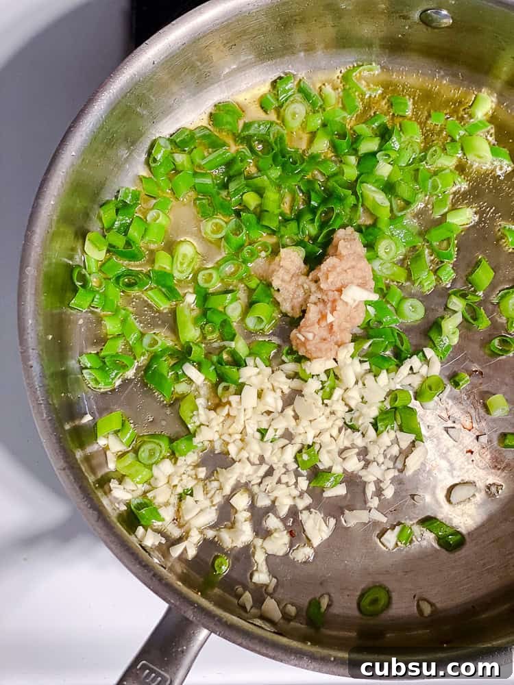 process shot showing ingredients cooking in pan