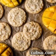 Cookies with sliced mangos peeking into the image.