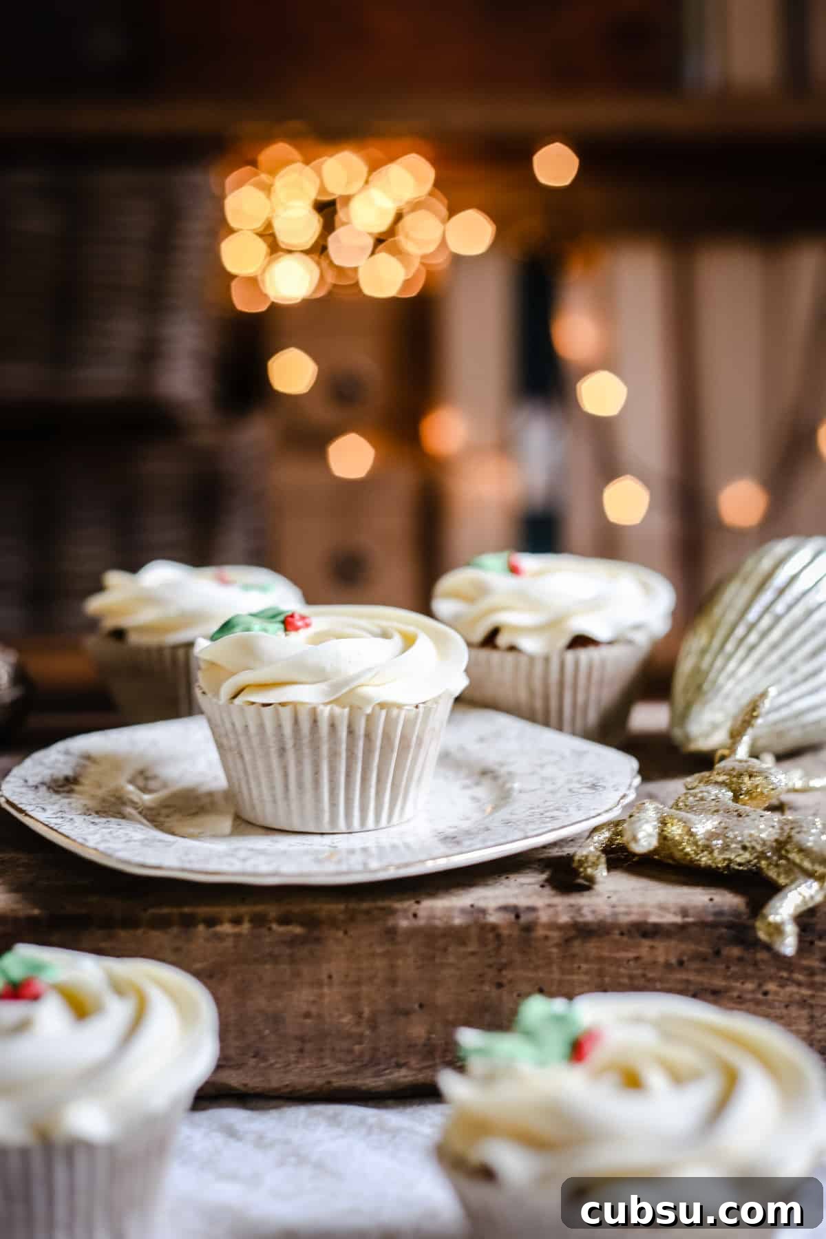 Mince Pie Cupcakes surrounded by christmas decorations and twinkling lights