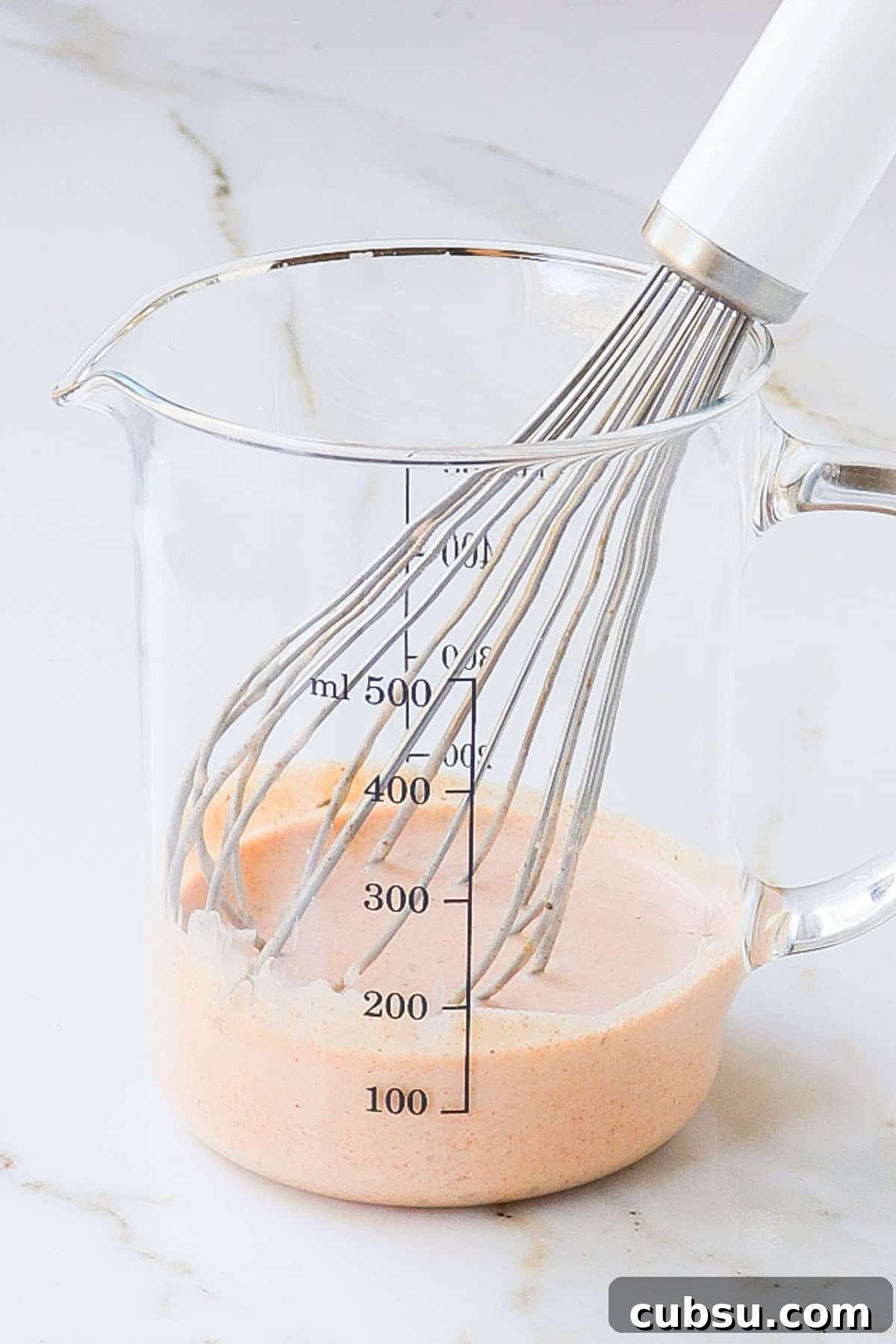 Zesty Cajun Shrimp Salad with Avocado and Lime Dressing 6 Cajun yoghurt dressing in a jug.