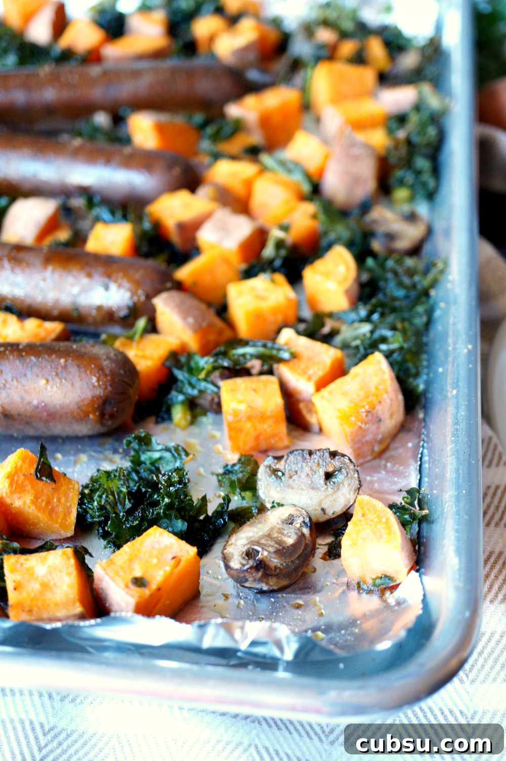 vegan sausage sheet pan meal with sweet potatoes and kale | The Baking Fairy