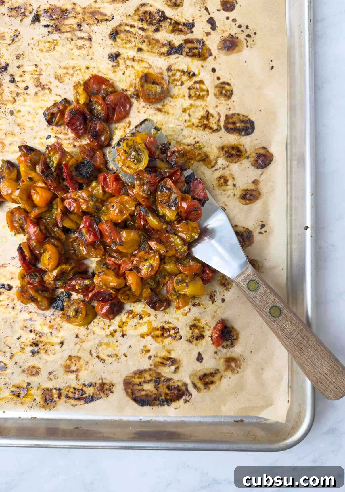 Cherry tomatoes after roasting on baking tray.