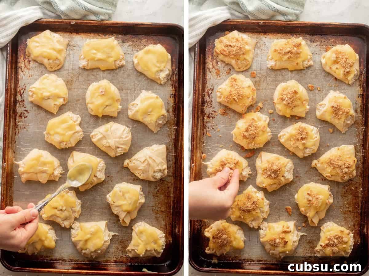 Spreading sauce over raw chicken roll ups and sprinkling crackers.
