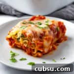 Spinach Lasagna Roll on a white plate.