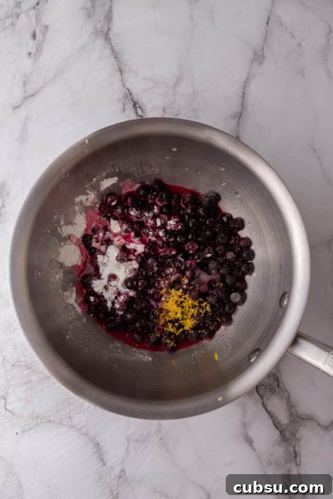 Chewy Blueberry Blondies Recipe with Lemon Glaze 5 unmixed fruit ingredients in a pot