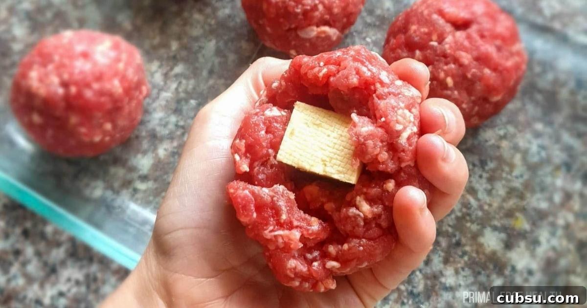 Uncooked cheese stuffed meatballs.