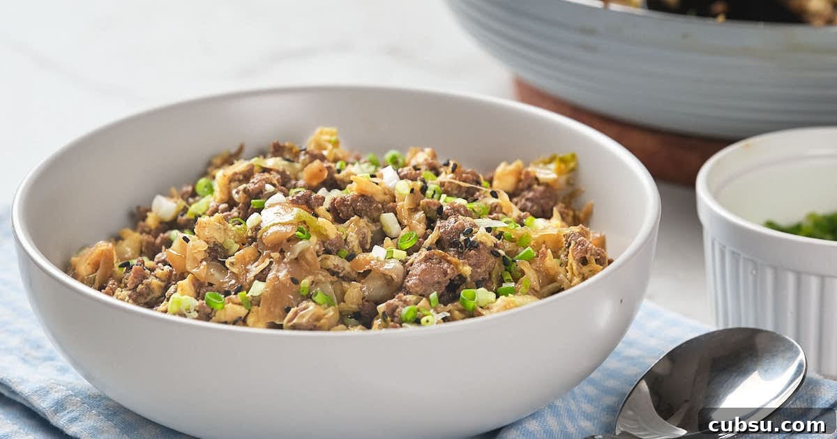 A white bowl filled with egg roll in a bowl recipe.