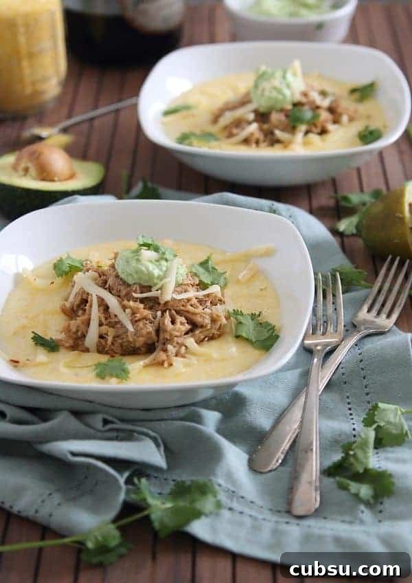 This slow cooker balsamic pulled pork is sweet and juicy served over cheesy polenta and topped with a cilantro infused avocado crema. Serious comfort food! This slow cooker balsamic pulled pork is sweet and juicy served over cheesy polenta and topped with a cilantro infused avocado crema. Serious comfort food!