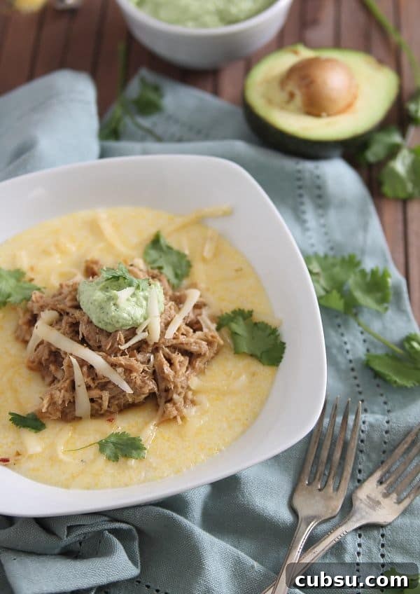 This slow cooker balsamic pulled pork is sweet and juicy served over cheesy polenta and topped with a cilantro infused avocado crema. This slow cooker balsamic pulled pork is sweet and juicy served over cheesy polenta and topped with a cilantro infused avocado crema.