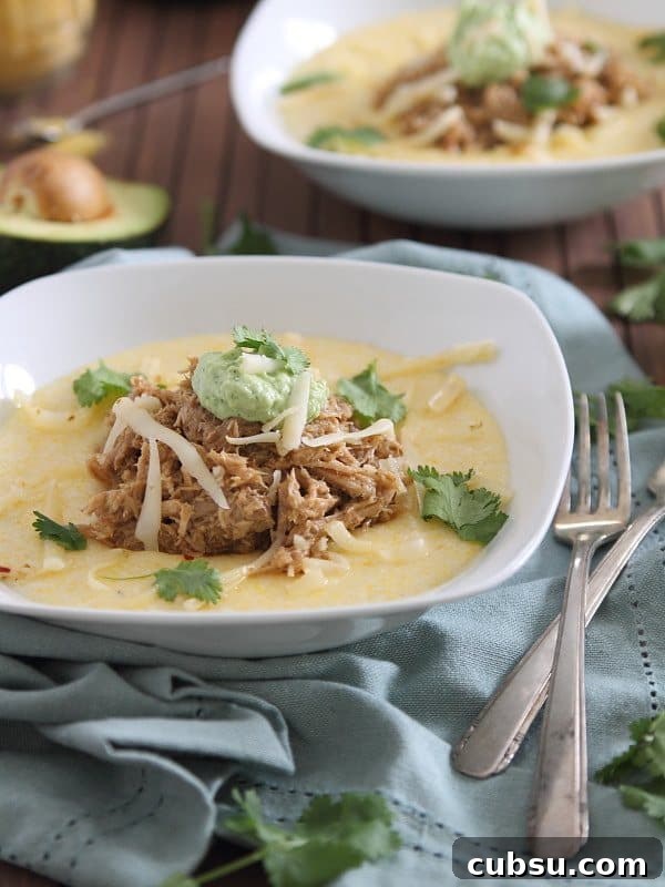 This slow cooker balsamic pulled pork is served over cheesy polenta and topped with a cilantro infused avocado crema. Serious comfort food! This slow cooker balsamic pulled pork is served over cheesy polenta and topped with a cilantro infused avocado crema. Serious comfort food!