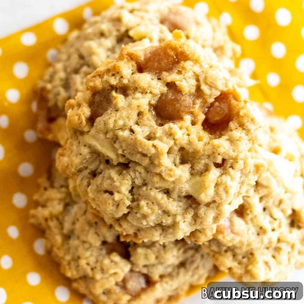 pile of caramel apple oatmeal cookies on yellow polka dot napkin