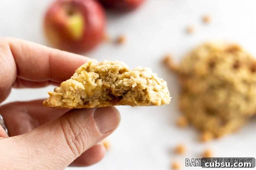 hand holding one of the caramel apple oatmeal cookies