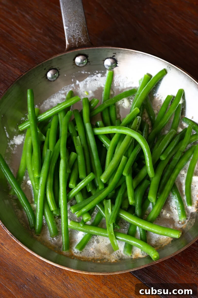 Crispy Pan-Fried Green Beans with Garlic and Lemon Zest 6 green beans in skillet