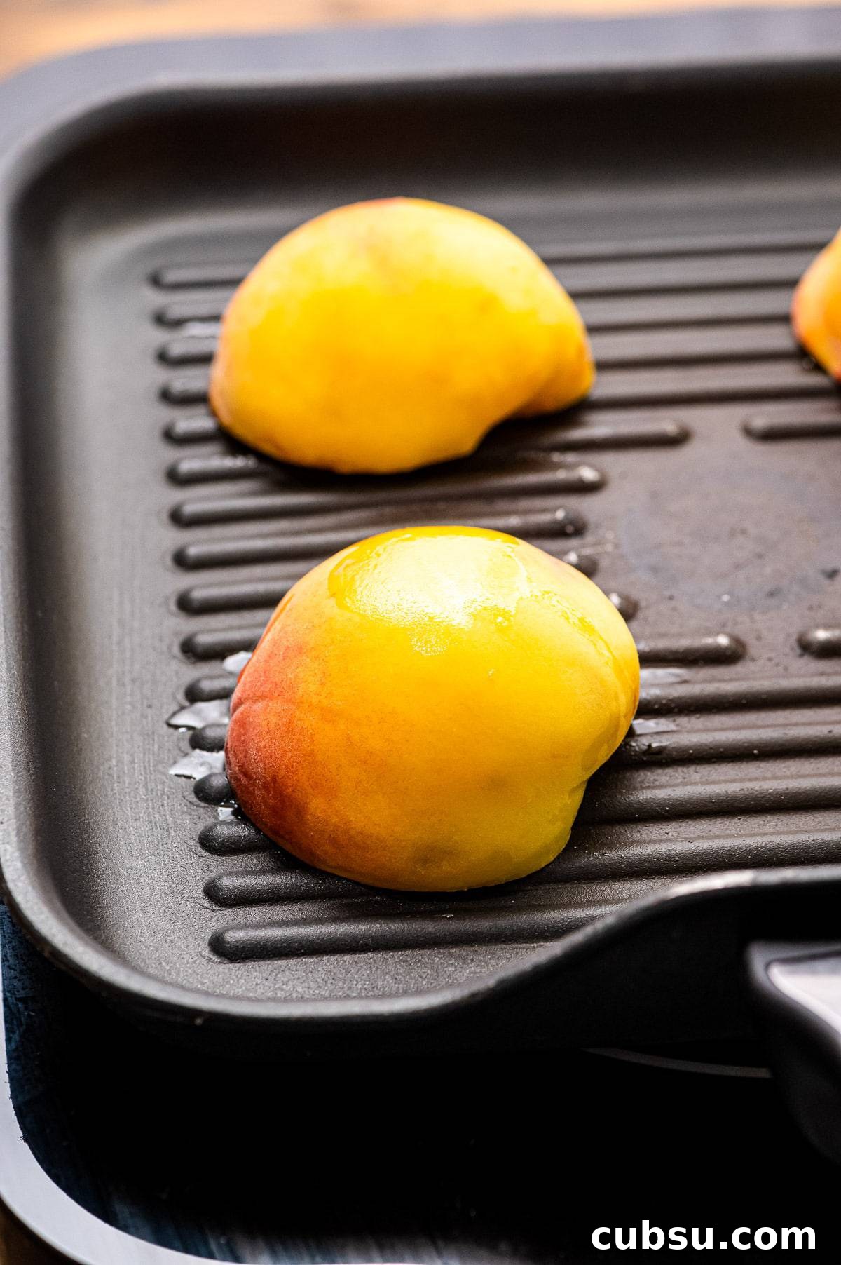 Grilled Peaches with Honey-Balsamic Glaze Recipe 6 Peach halves face down on grill pan