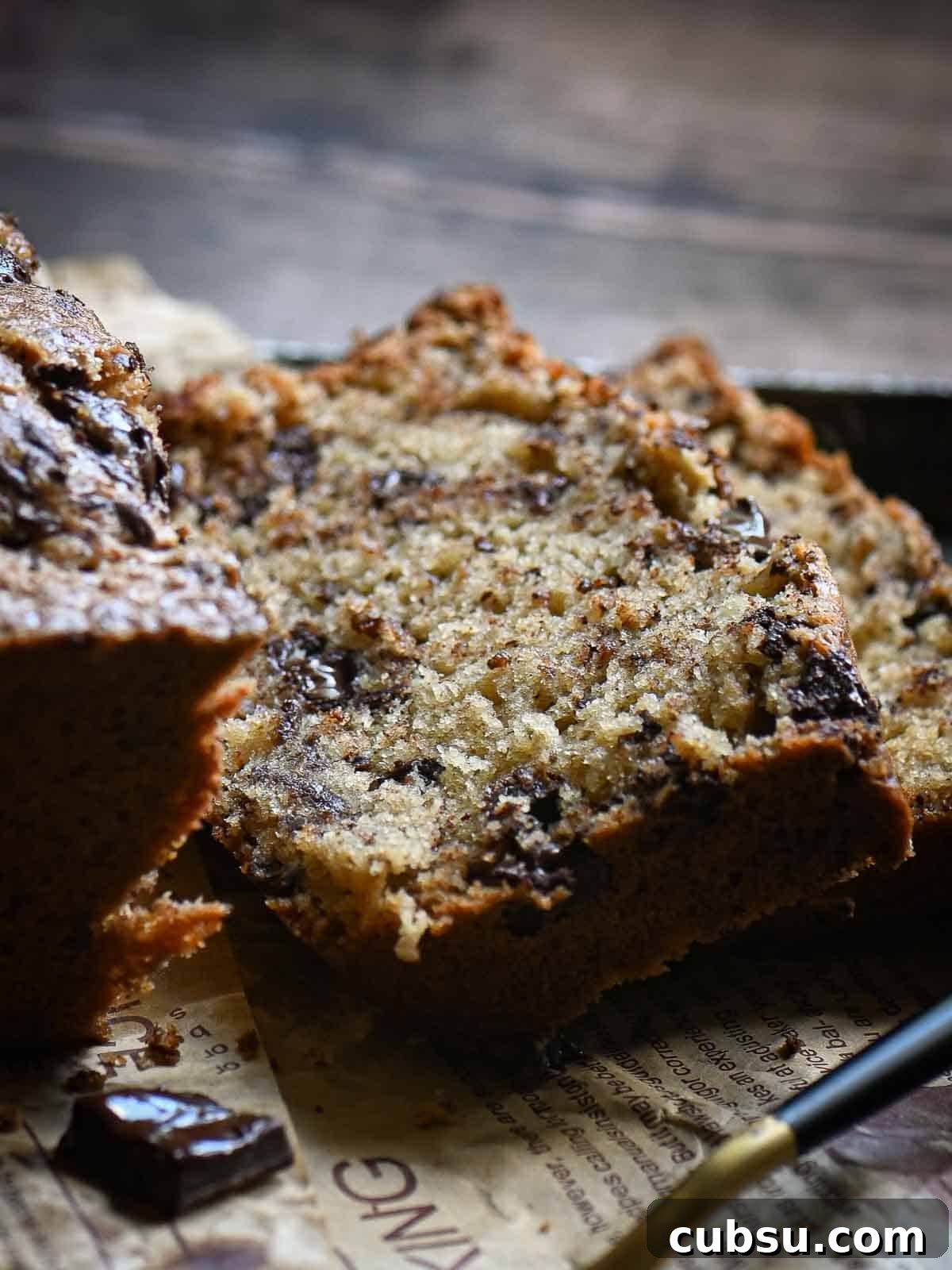 Close-up of chocolate loaf cake showing the melted chocolate chips.