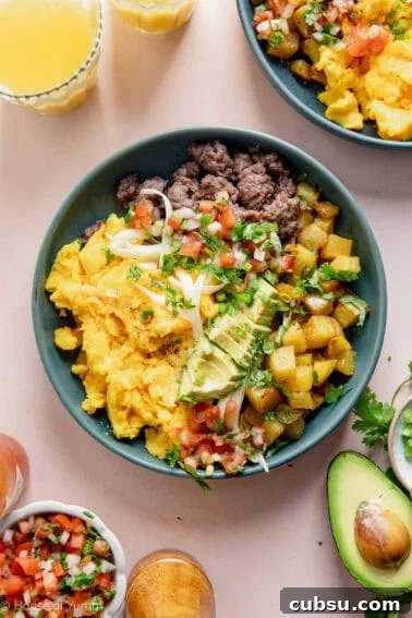 Cheesy Sausage Biscuit Recipe — Flaky Savory Breakfast Biscuits 11 Breakfast burrito bowl with scrambled eggs, sausage, potatoes, avocado and salsa.