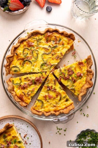 Cheesy Sausage Biscuit Recipe — Flaky Savory Breakfast Biscuits 12 Bacon and roasted jalapeño quiche sliced and topped with chives.