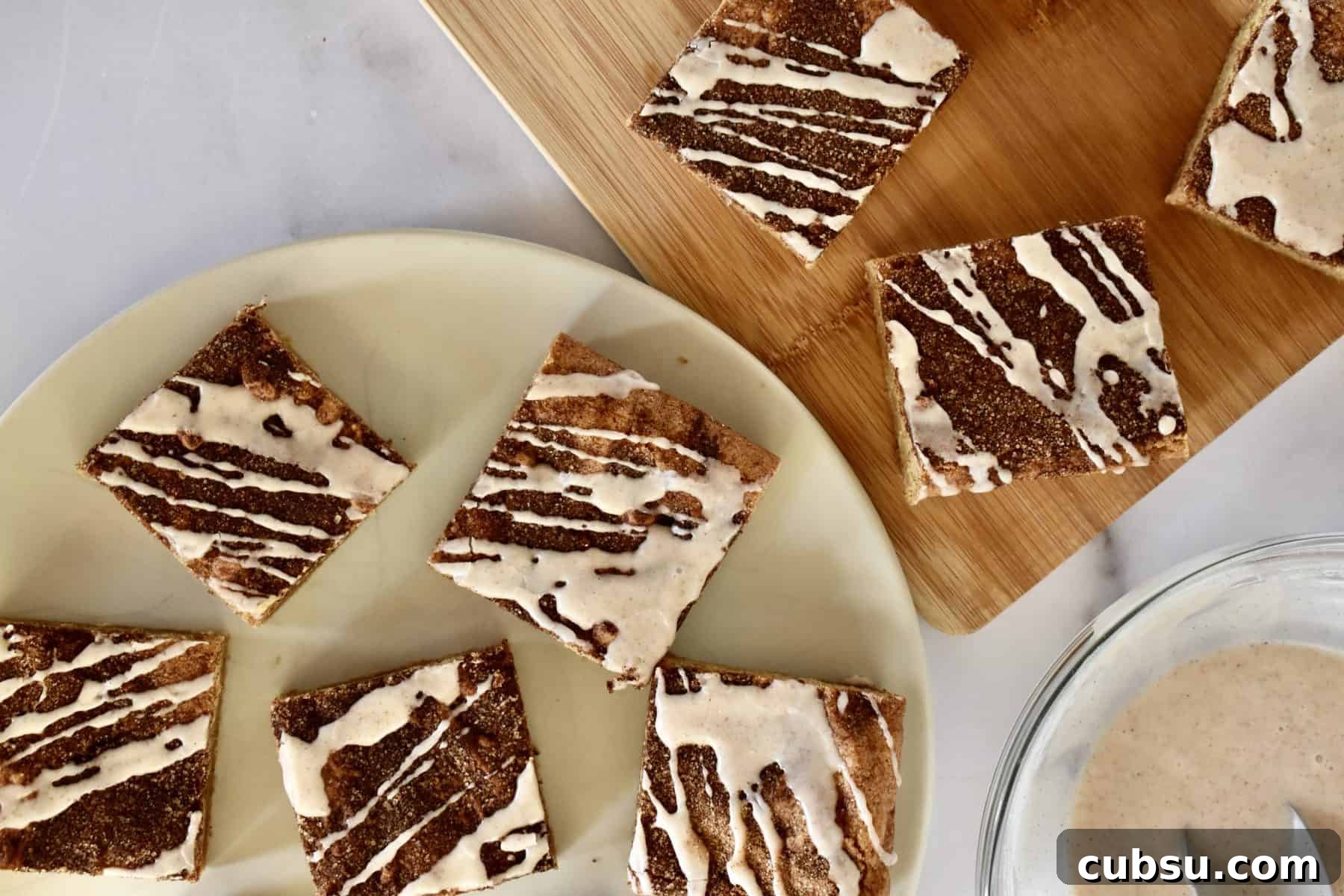 Chewy Cinnamon Sugar Blondies Recipe for Perfect Texture 11 Overhead photo of the glaze drizzled over the bars.