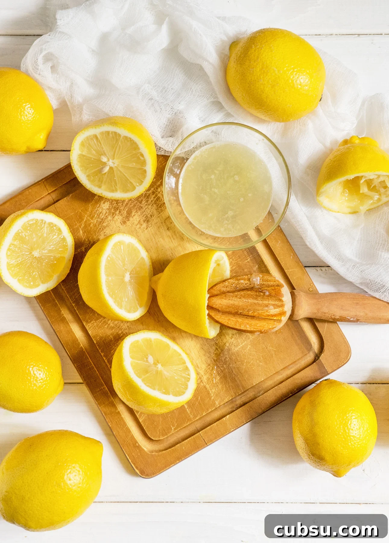 Squeezing lemon juice to make lemon curd