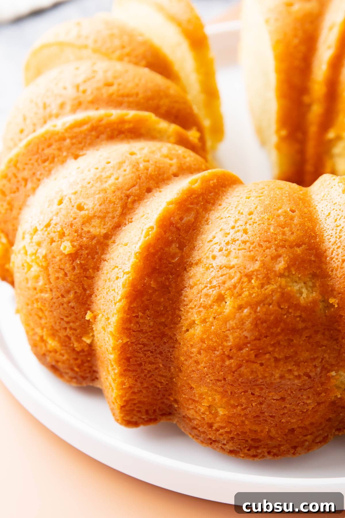 Classic Buttermilk Pound Cake Recipe with Tender Crumb 4 Old fashioned buttermilk pound cake has a golden brown exterior with tender, moist crumb inside due to a combination of flour, cardamom, baking soda, butter, sugar, 5 large eggs, vanilla, and room temperature buttermilk.