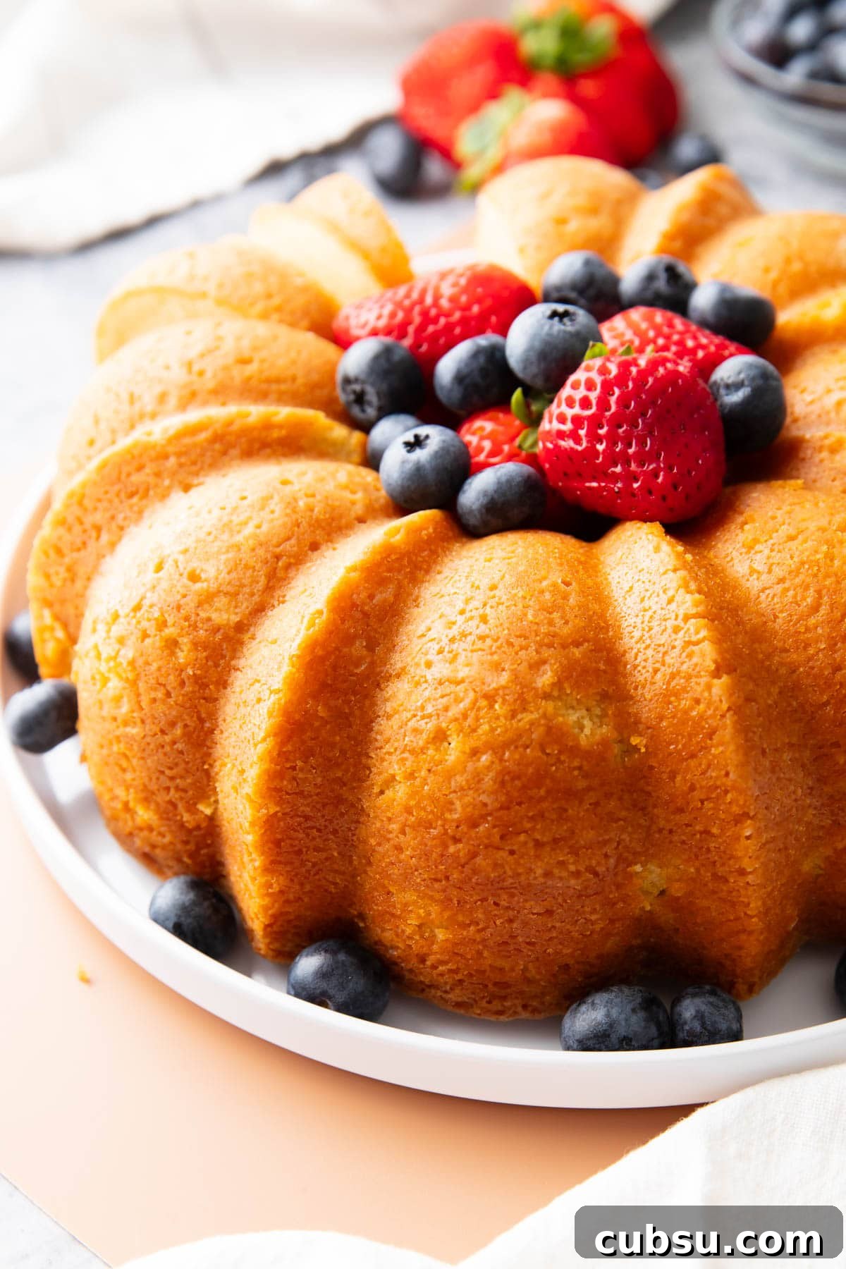 Classic Buttermilk Pound Cake Recipe with Tender Crumb 5 Serving this Southern pound cake with with blueberries and strawberries.