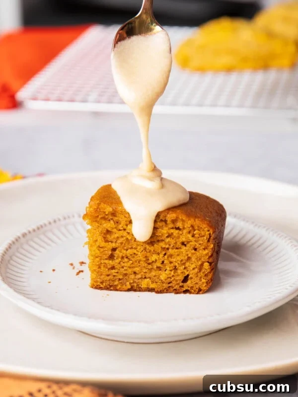 Classic Buttermilk Pound Cake Recipe with Tender Crumb 9 Spoon drizzling onto Pumpkin Cake - drizzling this sweet maple glaze thickly over a dessert