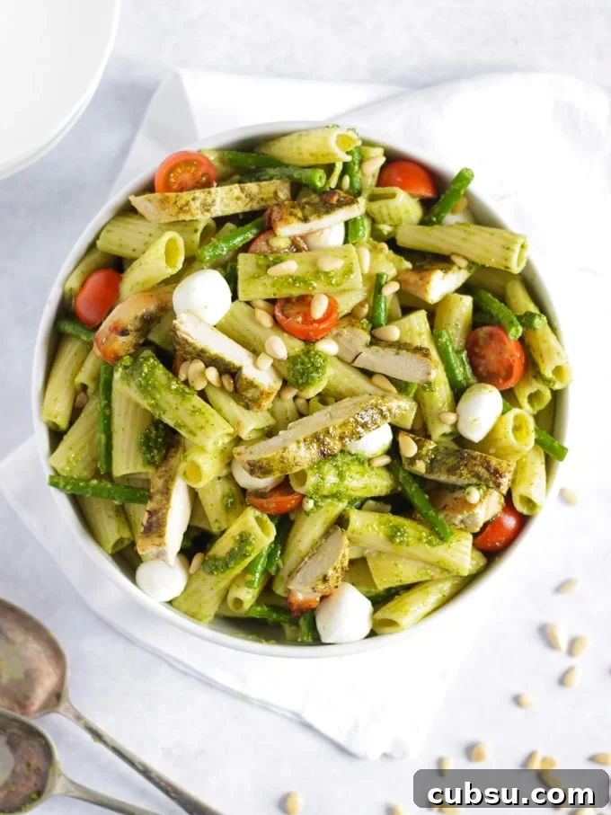 Chicken pesto pasta with tomatoes, green beans and mozzarella