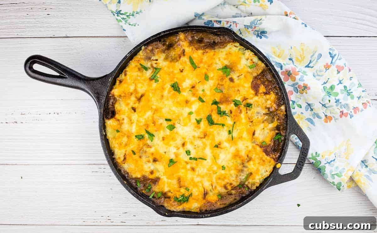 31 Classic Comfort Recipes That Keep Families Coming Back 27 Leftover Roast Beef Shepherd's Pie in a cast iron dish.