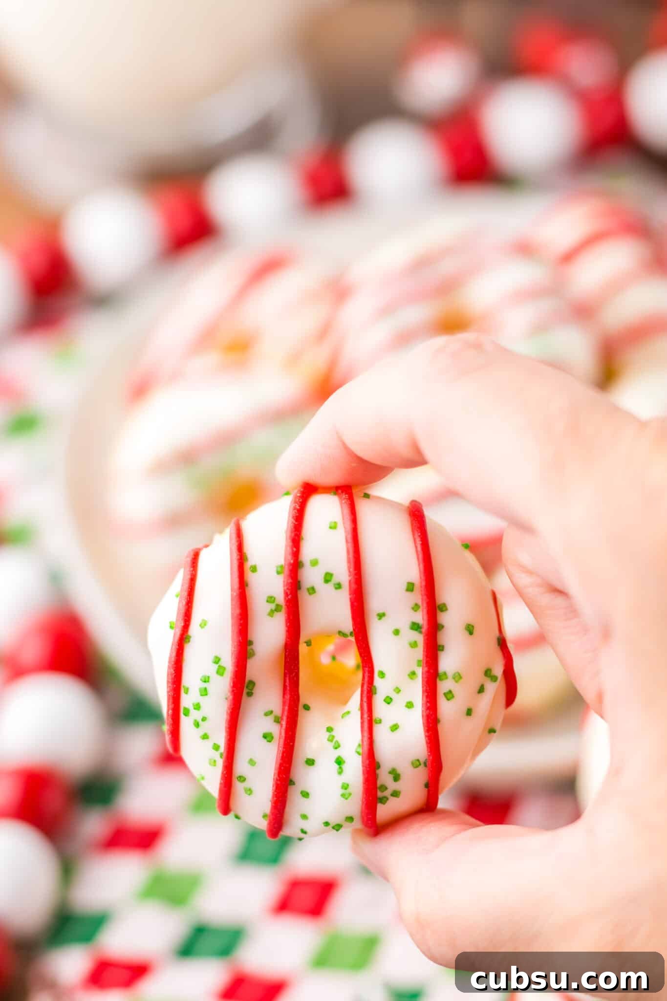 hand holding homemade little debbie christmas tree donut