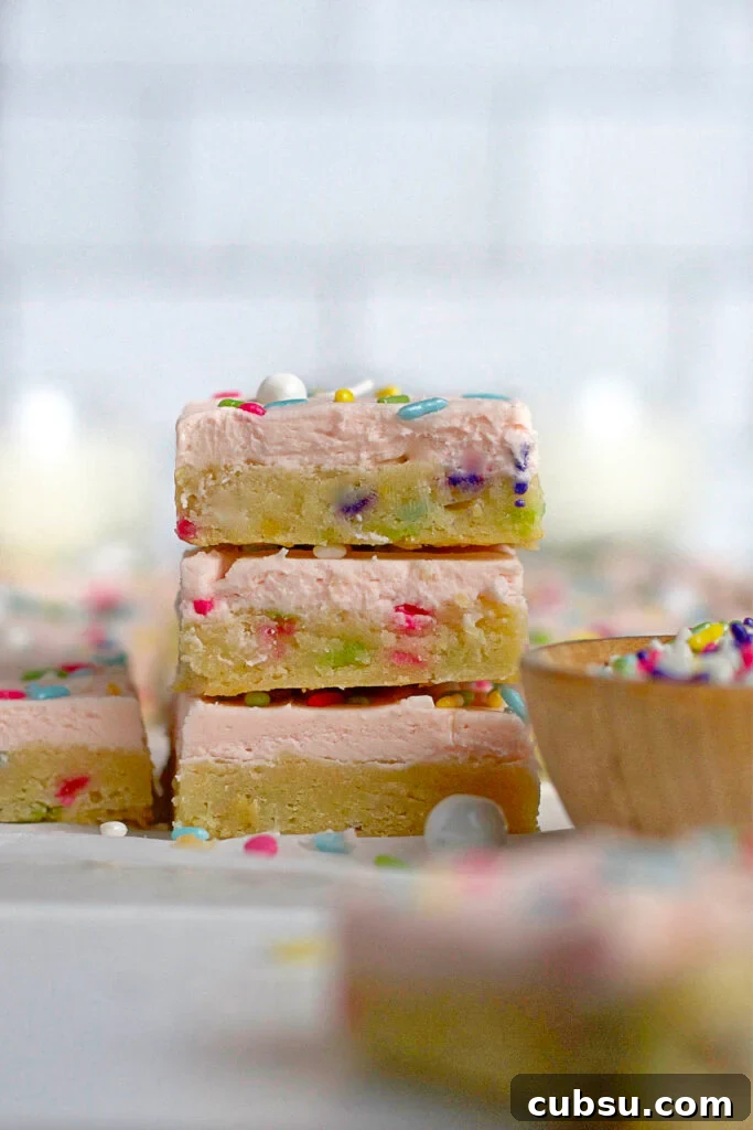 Cream Cheese Sugar Cookie Bars — Soft Frosted Dessert Bars 2 stack of three sugar cookie bars with sprinkles