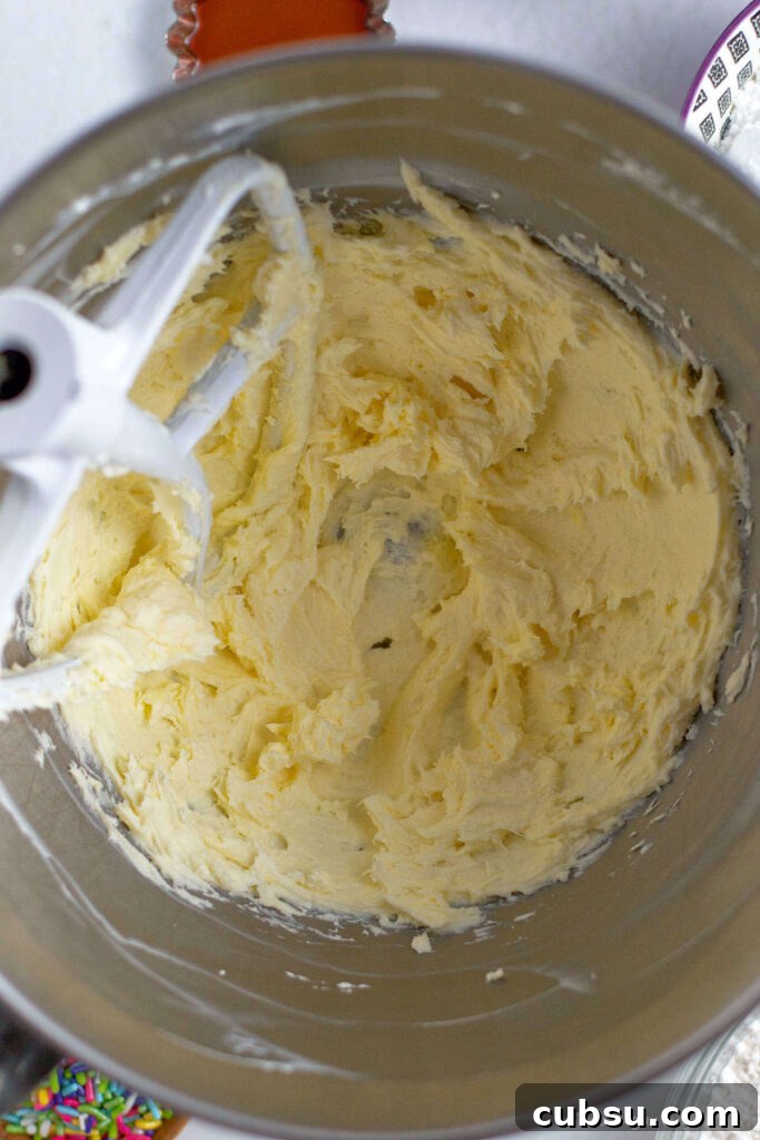 Cream Cheese Sugar Cookie Bars — Soft Frosted Dessert Bars 6 butter and cream cheese mixed together in a mixing bowl
