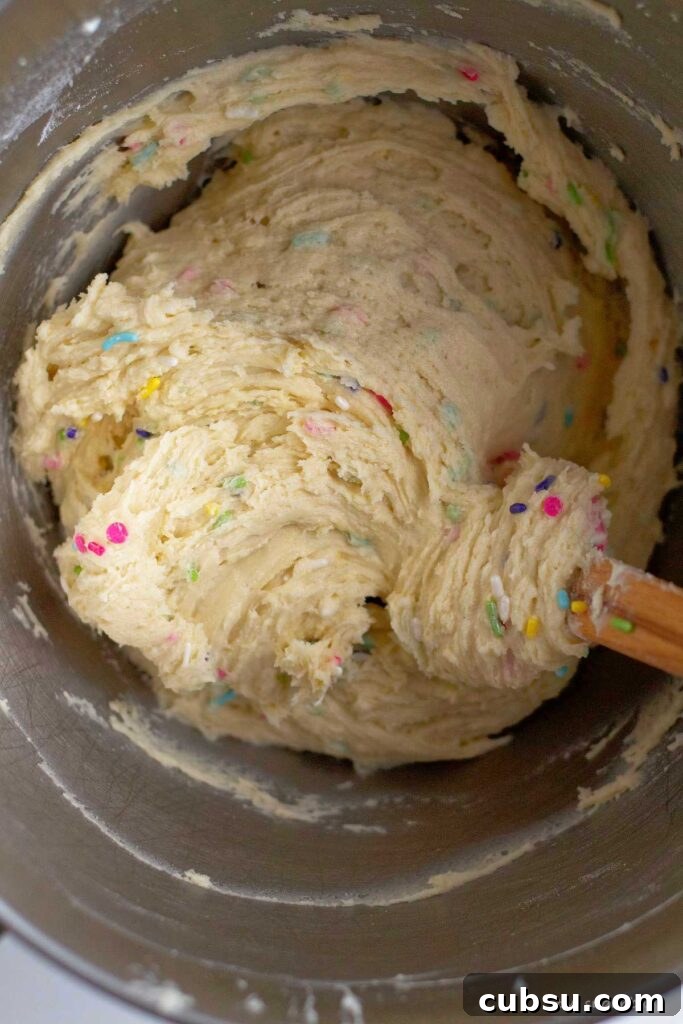 Cream Cheese Sugar Cookie Bars — Soft Frosted Dessert Bars 10 mixed sugar cookie bar dough in mixing bowl