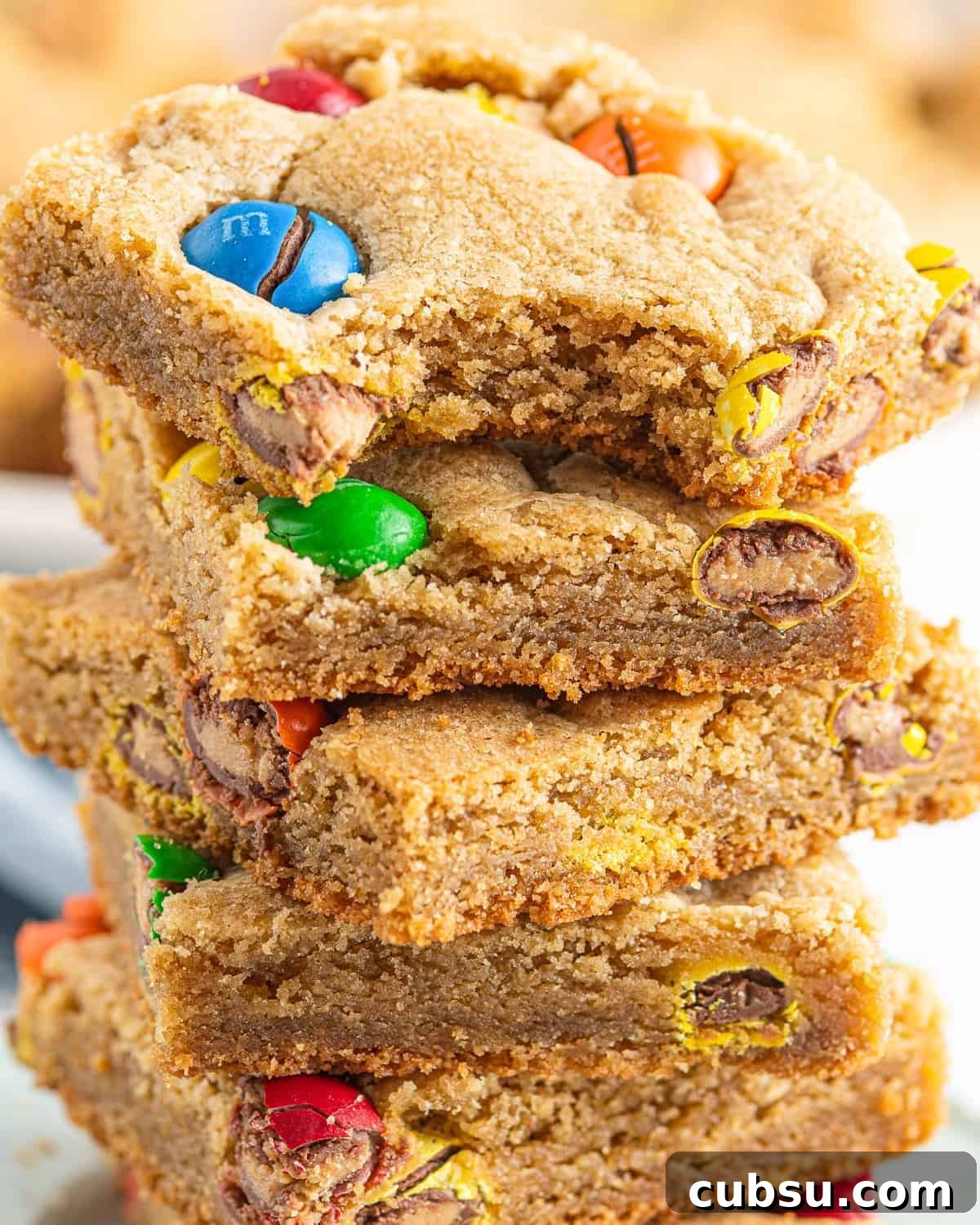 M&M Blondies Recipe: Chewy Chocolate Candy Bar Blondies 2 A stack of M&M blondies.
