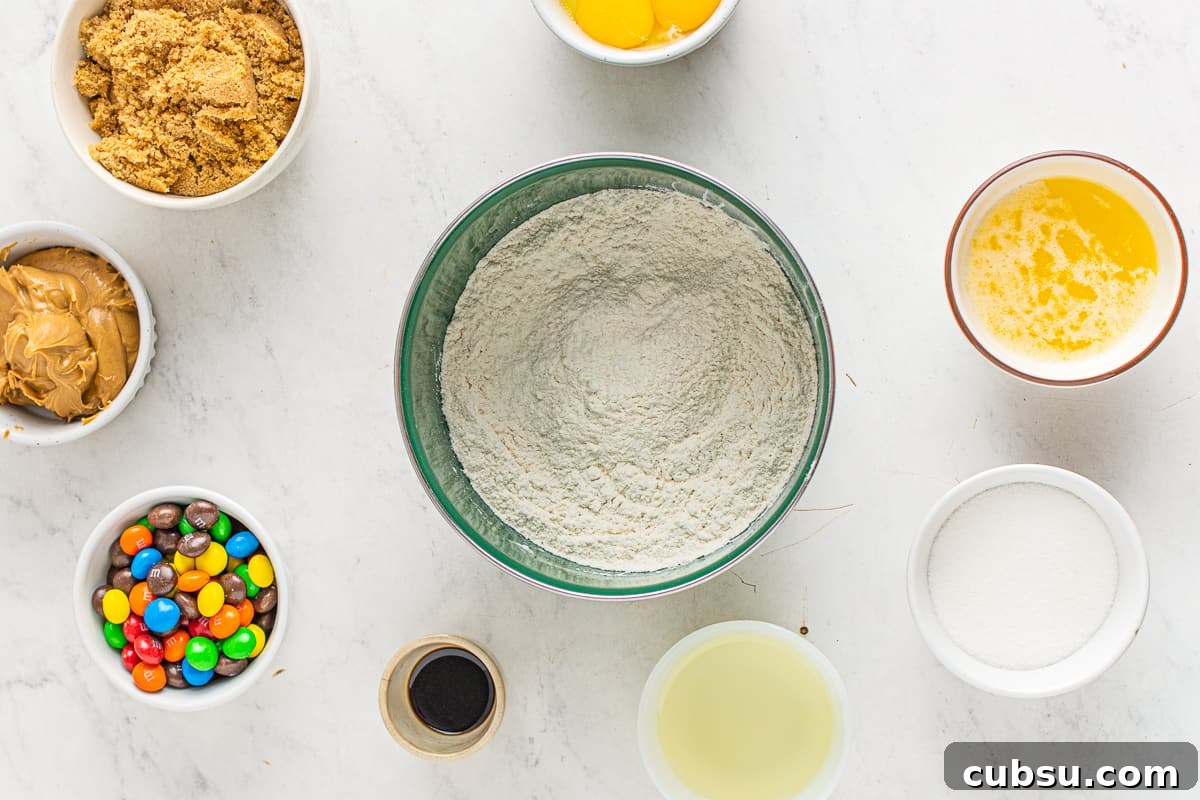 M&M Blondies Recipe: Chewy Chocolate Candy Bar Blondies 6 Blondie ingredients circling a bowl of dry ingredients.