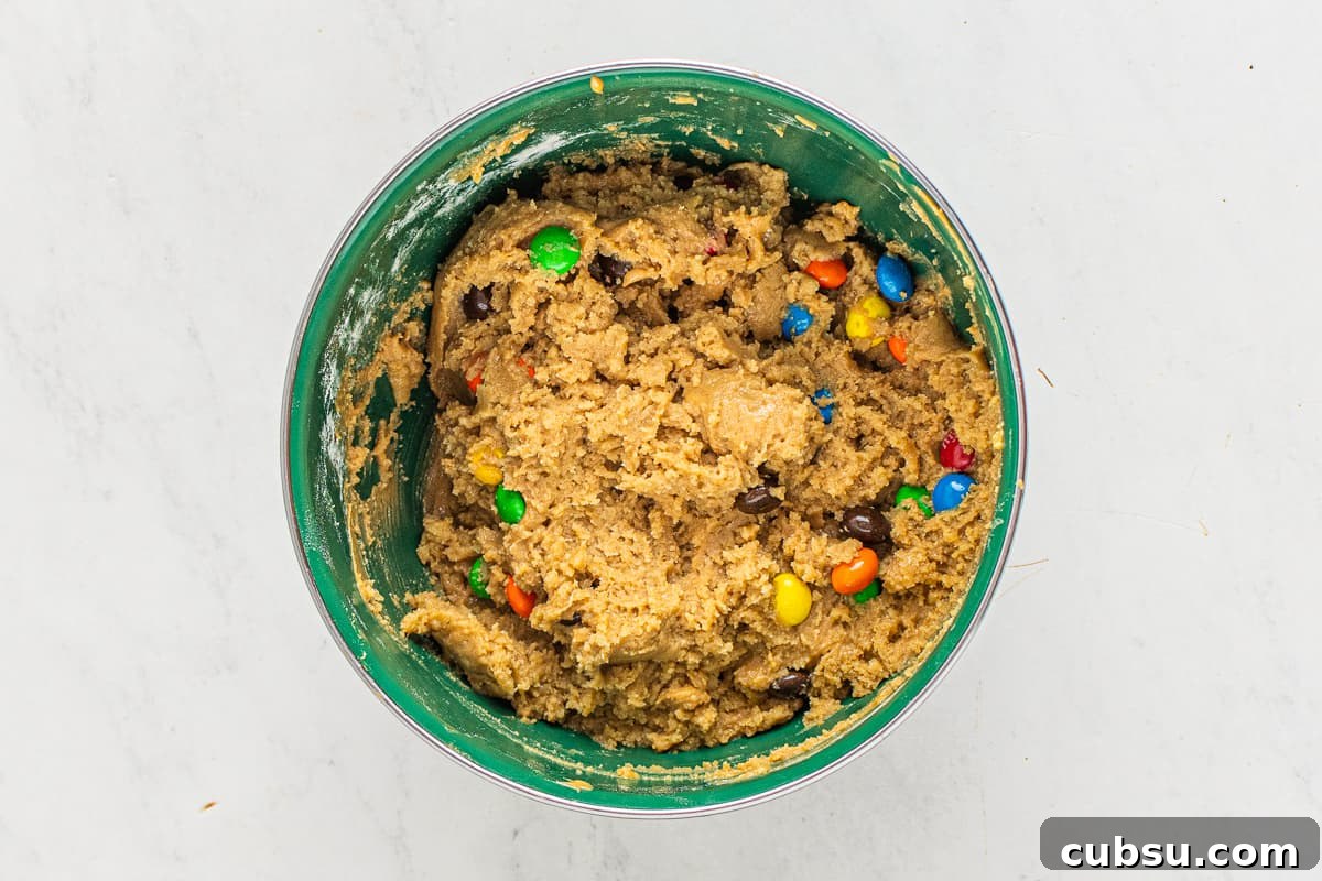 M&M Blondies Recipe: Chewy Chocolate Candy Bar Blondies 7 M&M blondie dough in a mixing bowl.