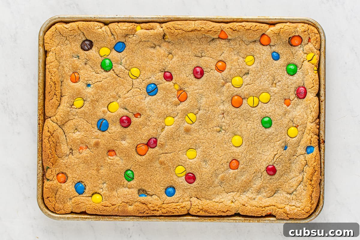 M&M Blondies Recipe: Chewy Chocolate Candy Bar Blondies 9 A tray of baked M&M blondies.