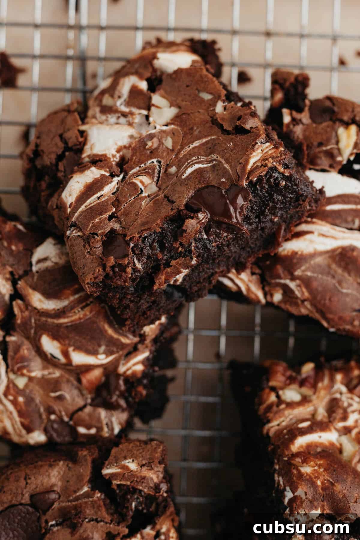 Marshmallow swirl brownies on a wire cooling rack.