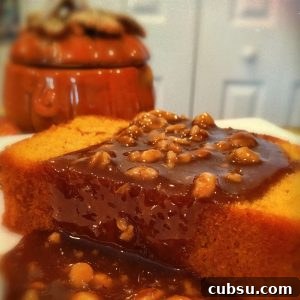 Slice of Pumpkin Pound cake with Walnut Caramel Sauce on a dessert plate.