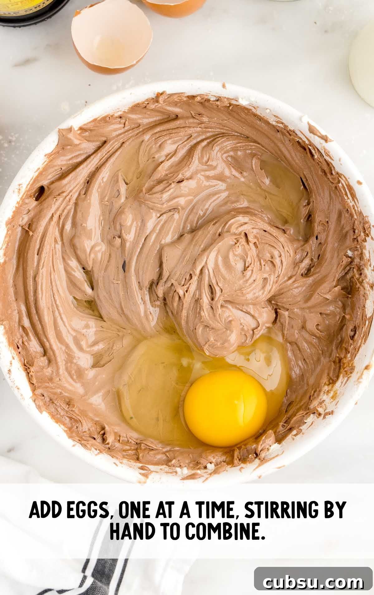 eggs added to the flour mixture in a bowl