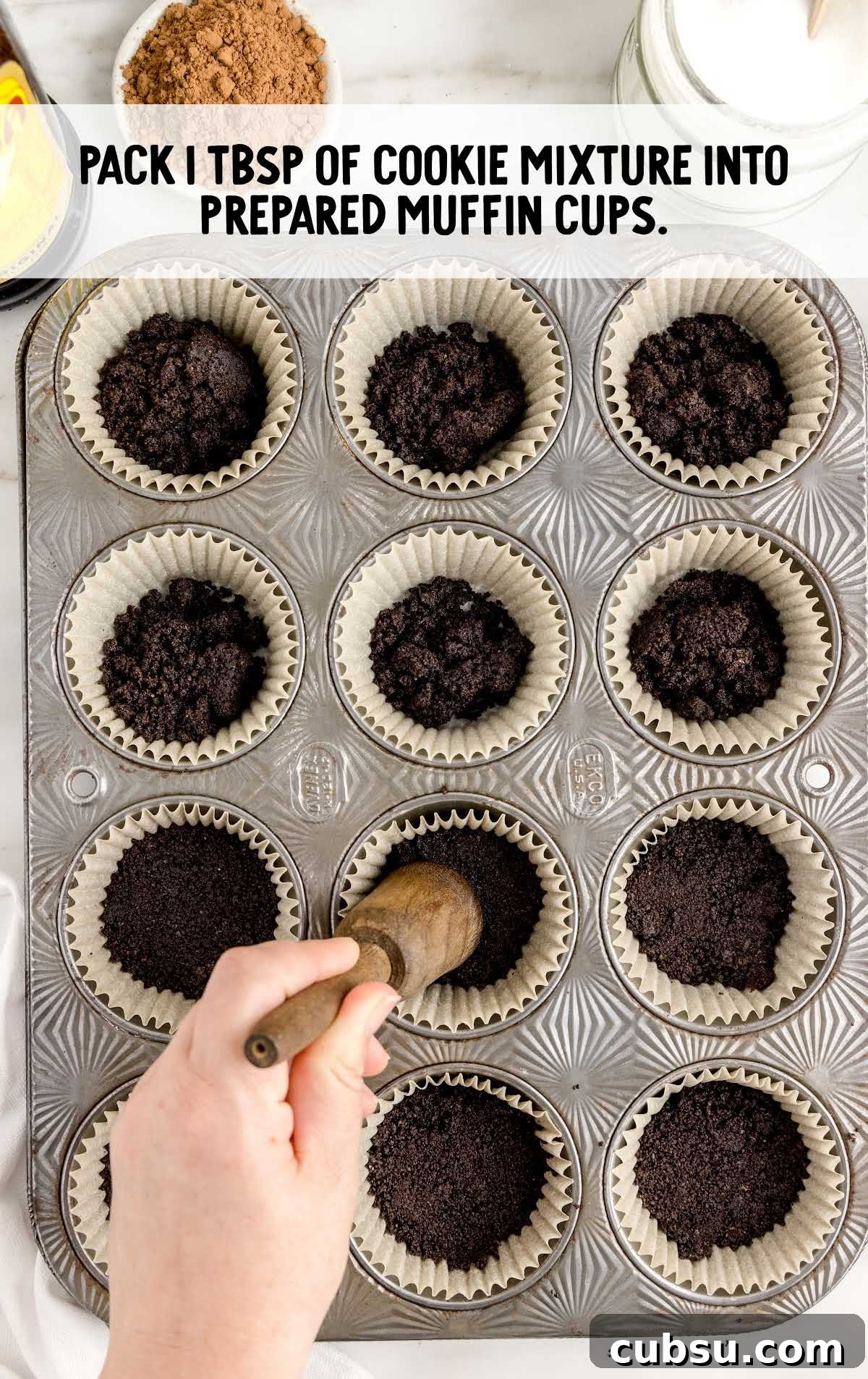 cookie mixture placed into the muffin cups in a cupcake baking tray