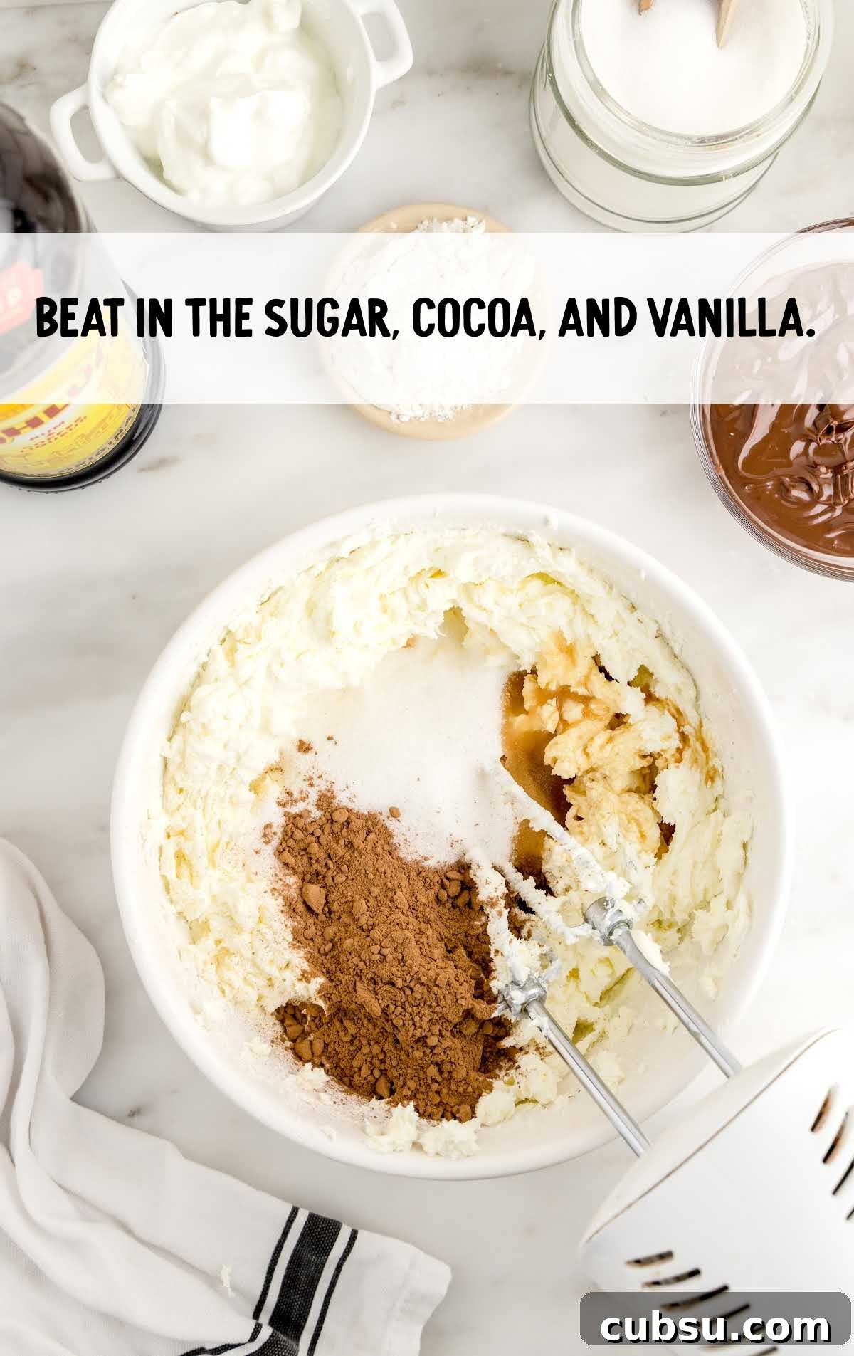 sugar, cocoa, and vanilla blended in a bowl