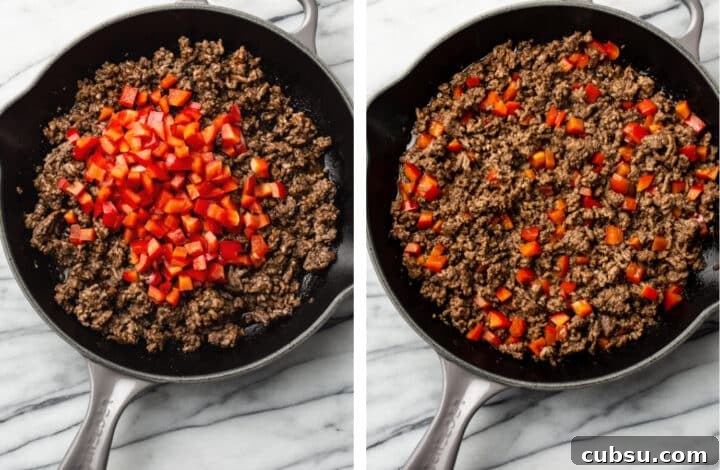 adding red bell pepper to a skillet with seasoned ground beef