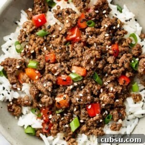 a bowl of asian inspired ground beef over rice