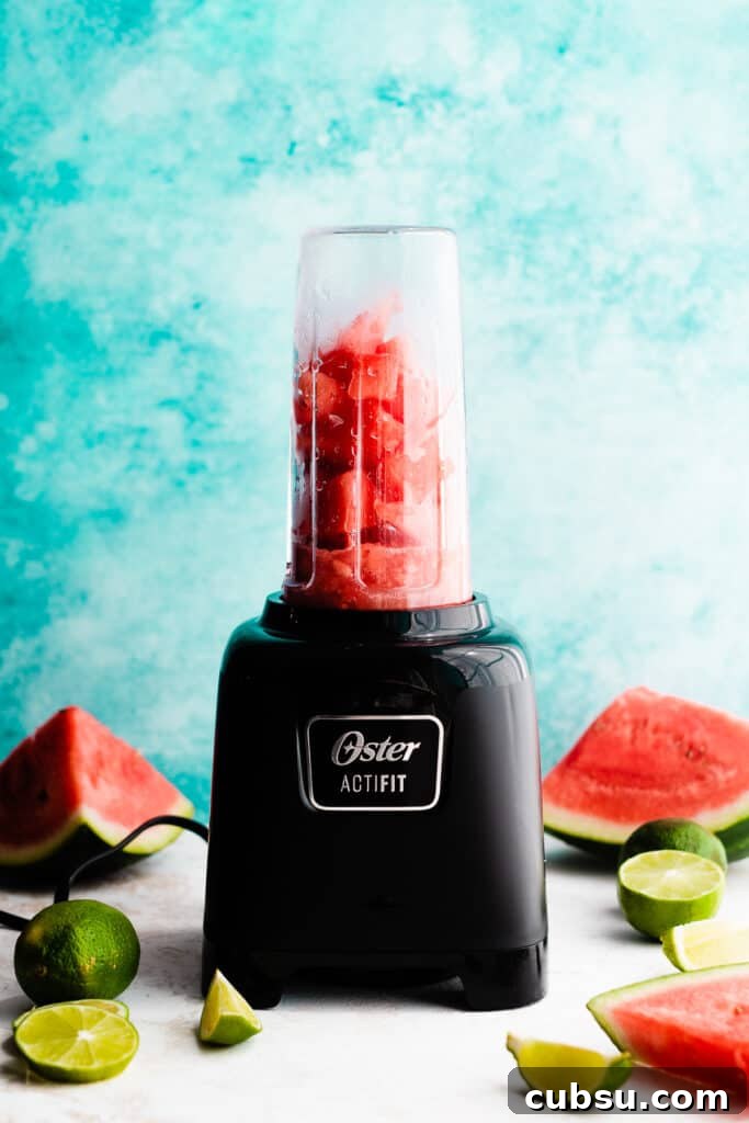 A blender with the margarita ingredients.