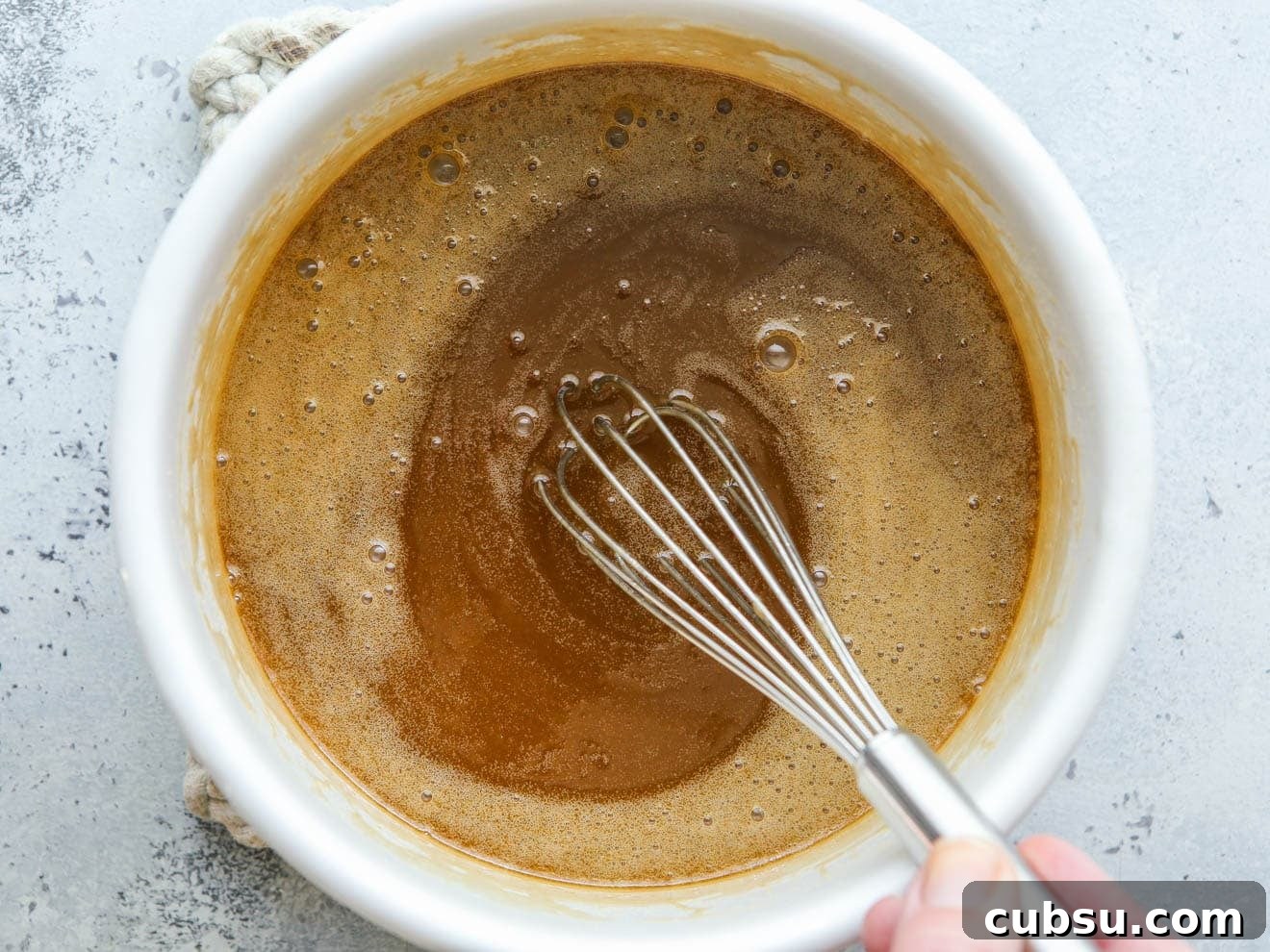 Whisking caramel sauce