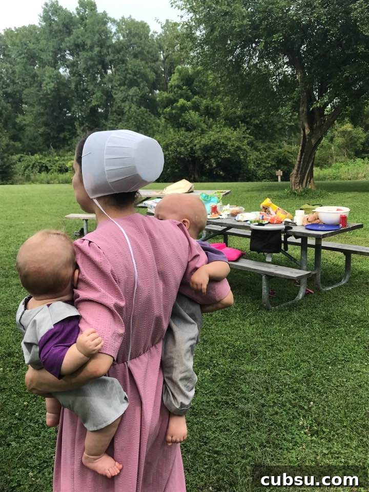 Gloria holding baby Elijah and Jesse